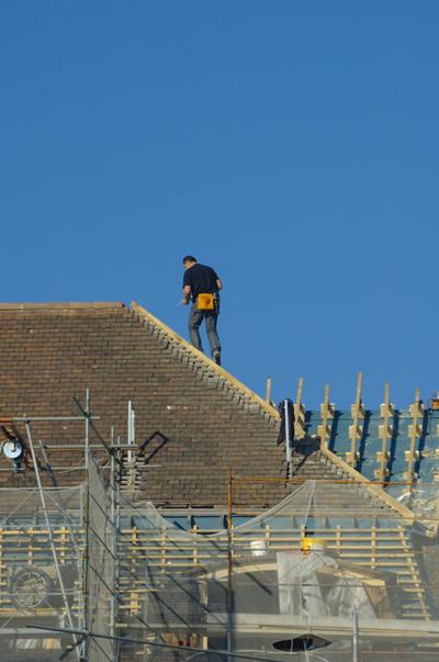 Rome Roofer working on a roof